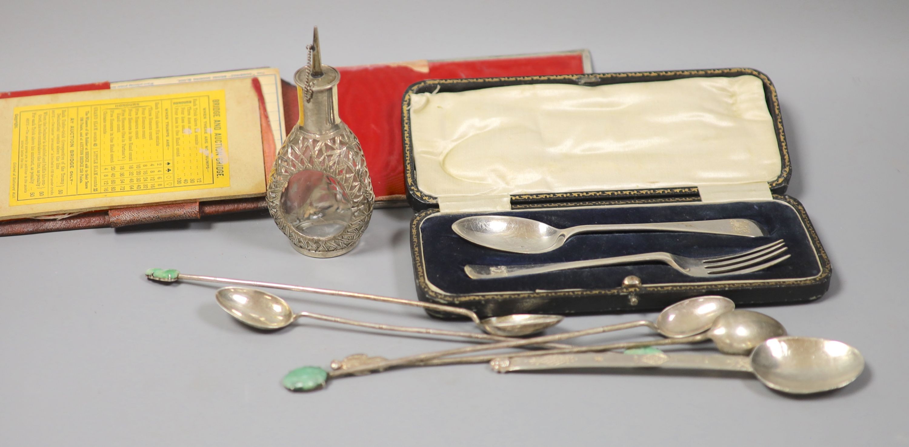 A modern silver spoon by Amy Sandheim (a.f.), a cased silver christening pair, a mounted bridge pad and Chinese cocktail spoons with jade terminals by Tack Hing, one other spoon and a similar scent bottle.